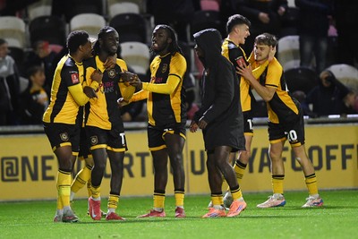011125 - Newport County v Gillingham - FA Cup First Round - Ben Lloyd of Newport County celebrates with team mates after he scores the winning penalty 