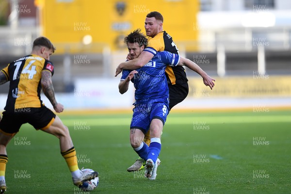 011125 - Newport County v Gillingham - FA Cup First Round - Lee Jenkins of Newport County is challenged by Armani Little of Gillingham