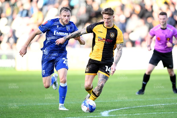 011125 - Newport County v Gillingham - FA Cup First Round - Kai Whitmore of Newport County is challenged by Elliott Nevitt of Gillingham