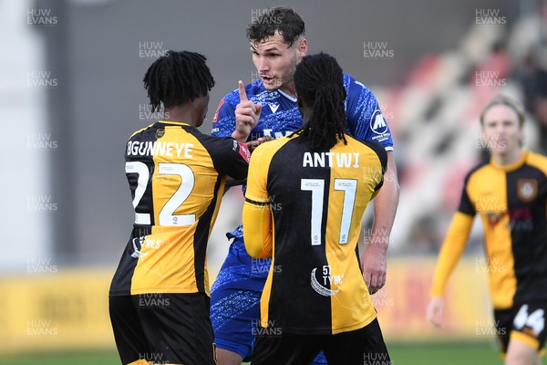 011125 - Newport County v Gillingham - FA Cup First Round - Josh Andrews of Gillingham has a disagreement with Habeeb Ogunneye of Newport County and Cameron Antwi of Newport County