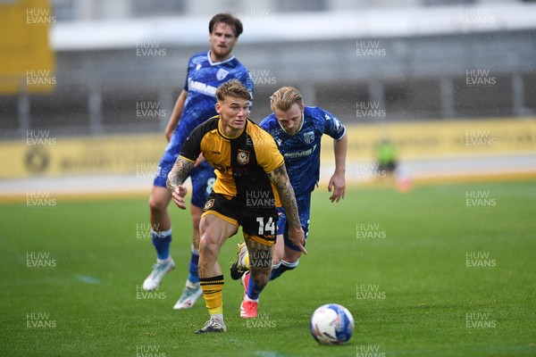 011125 - Newport County v Gillingham - FA Cup First Round - Kai Whitmore of Newport County is challenged by Max Clark of Gillingham