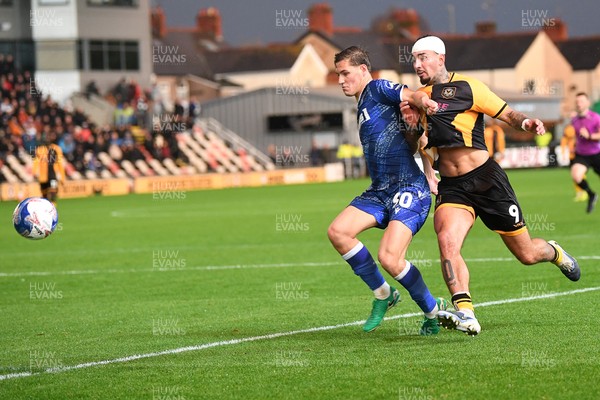 011125 - Newport County v Gillingham - FA Cup First Round - Courtney Baker-Richardson of Newport County is challenged by Elliott Nevitt of Gillingham