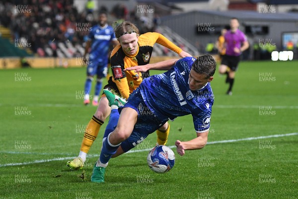 011125 - Newport County v Gillingham - FA Cup First Round - Sam Braybrooke of Newport County is challenged by Max Clark of Gillingham