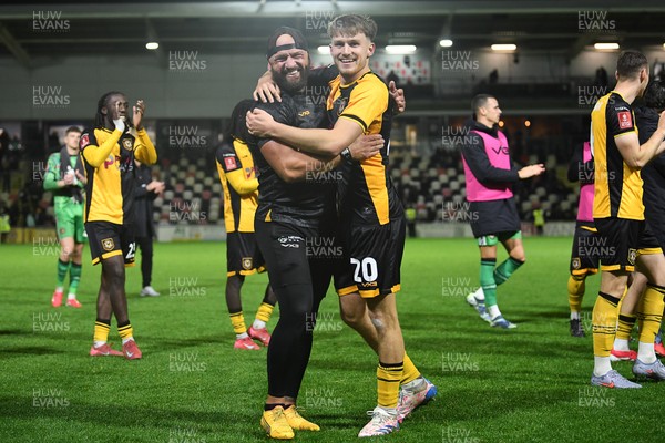 011125 - Newport County v Gillingham - FA Cup First Round - Ben Lloyd of Newport County celebrates after scoring the winning penalty with David Pipe