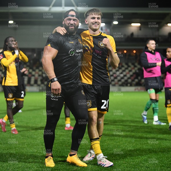 011125 - Newport County v Gillingham - FA Cup First Round - Ben Lloyd of Newport County celebrates after scoring the winning penalty with David Pipe