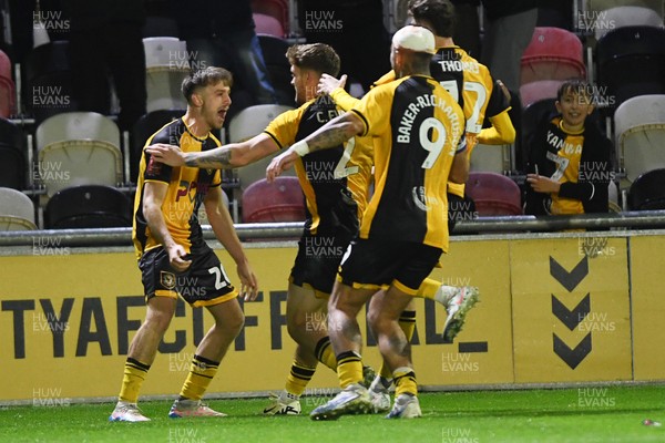 011125 - Newport County v Gillingham - FA Cup First Round - Ben Lloyd of Newport County celebrates with team mates after he scores the winning penalty 