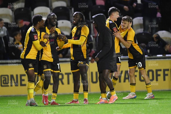 011125 - Newport County v Gillingham - FA Cup First Round - Ben Lloyd of Newport County celebrates with team mates after he scores the winning penalty 