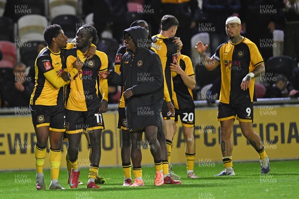 011125 - Newport County v Gillingham - FA Cup First Round - Ben Lloyd of Newport County celebrates with team mates after he scores the winning penalty 