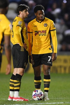 040325 - Newport County v Gillingham - Sky Bet League 2 - Anthony Glennon and Bobby Kamwa of Newport County look over the free kick