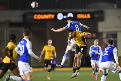 040325 - Newport County v Gillingham - Sky Bet League 2 - Courtney Baker-Richardson of Newport County is challenged by Armani Little of Gillingham