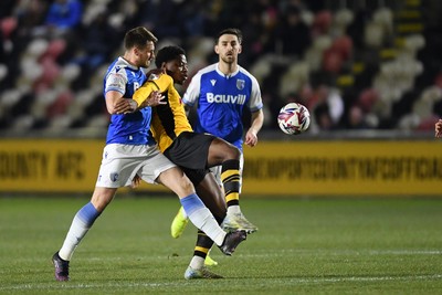 040325 - Newport County v Gillingham - Sky Bet League 2 - Bobby Kamwa of Newport County is challenged by Armani Little of Gillingham