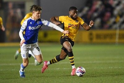 040325 - Newport County v Gillingham - Sky Bet League 2 - David Ajiboye of Newport County is chased down by Sam Gale of Gillingham