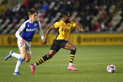 040325 - Newport County v Gillingham - Sky Bet League 2 - David Ajiboye of Newport County is chased down by Sam Gale of Gillingham