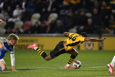 040325 - Newport County v Gillingham - Sky Bet League 2 - David Ajiboye of Newport County is tackled by Sam Gale of Gillingham just outside the box