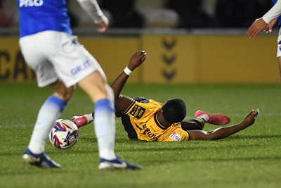 040325 - Newport County v Gillingham - Sky Bet League 2 - David Ajiboye of Newport County is tackled by Sam Gale of Gillingham just outside the box