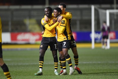 040325 - Newport County v Gillingham - Sky Bet League 2 - Bobby Kamwa of Newport County celebrates scoring his second goal of the match with team mates