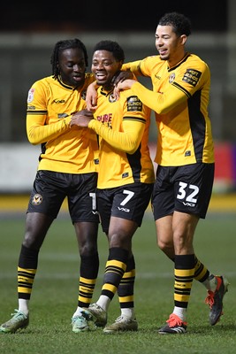 040325 - Newport County v Gillingham - Sky Bet League 2 - Bobby Kamwa of Newport County celebrates scoring his second goal of the match with team mates