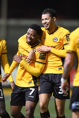 040325 - Newport County v Gillingham - Sky Bet League 2 - Bobby Kamwa of Newport County celebrates scoring his second goal of the match with team mates