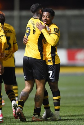 040325 - Newport County v Gillingham - Sky Bet League 2 - Bobby Kamwa of Newport County celebrates scoring his second goal of the match with team mates