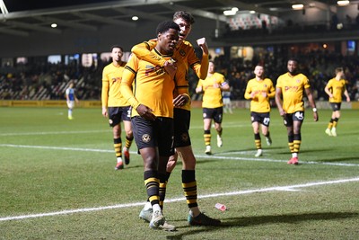 040325 - Newport County v Gillingham - Sky Bet League 2 - Bobby Kamwa of Newport County celebrates scoring his third goal with team mates and completes his first half hat-trick 