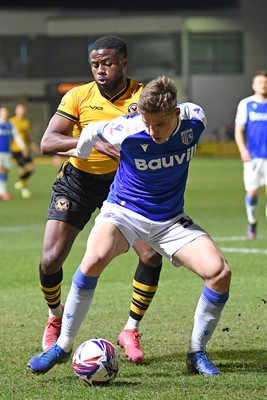 040325 - Newport County v Gillingham - Sky Bet League 2 - David Ajiboye of Newport County is challenged by Sam Gale of Gillingham