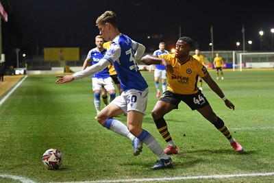 040325 - Newport County v Gillingham - Sky Bet League 2 - David Ajiboye of Newport County is challenged by Sam Gale of Gillingham