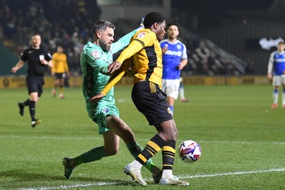 040325 - Newport County v Gillingham - Sky Bet League 2 - Bobby Kamwa of Newport County is challenged by Glenn Morris of Gillingham