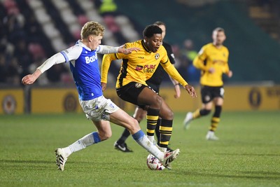 040325 - Newport County v Gillingham - Sky Bet League 2 - Bobby Kamwa of Newport County is challenged by Andy Smith of Gillingham