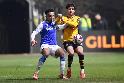 040325 - Newport County v Gillingham - Sky Bet League 2 - Anthony Glennon of Newport County is challenged by Remeao Hutton of Gillingham