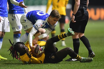 040325 - Newport County v Gillingham - Sky Bet League 2 - Cameron Antwi of Newport County has the ball taken by Sam Gale of Gillingham