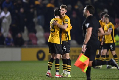 040325 - Newport County v Gillingham - Sky Bet League 2 - Matthew Baker and Anthony Glennon of Newport County celebrate the win at full time