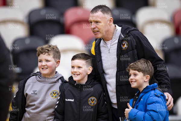 170224 - Newport County v Gillingham - Sky Bet League 2 - Newport County manager Graham Coughlan poses with young fans ahead of the match