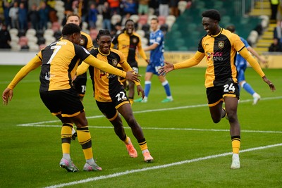 200925 - Newport County v Gillingham - Sky Bet League 2 - Nathan Opoku of Newport County celebrates scoring a goal with team mates