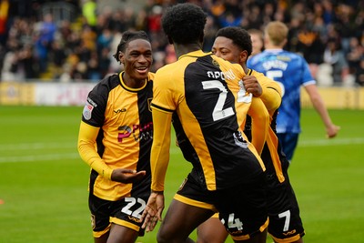200925 - Newport County v Gillingham - Sky Bet League 2 - Nathan Opoku of Newport County celebrates scoring a goal with team mates