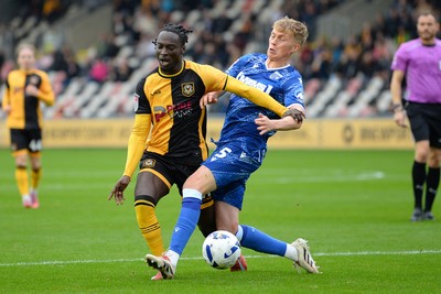 200925 - Newport County v Gillingham - Sky Bet League 2 - Cameron Antwi of Newport County is fouled in the box by Andy Smith of Gillingham and receives a penalty