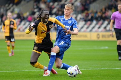 200925 - Newport County v Gillingham - Sky Bet League 2 - Cameron Antwi of Newport County is fouled in the box by Andy Smith of Gillingham and receives a penalty