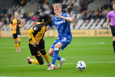 200925 - Newport County v Gillingham - Sky Bet League 2 - Cameron Antwi of Newport County is fouled in the box by Andy Smith of Gillingham and receives a penalty