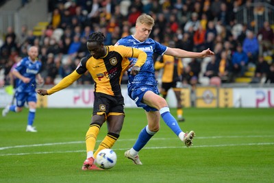 200925 - Newport County v Gillingham - Sky Bet League 2 - Cameron Antwi of Newport County is fouled in the box by Andy Smith of Gillingham and receives a penalty