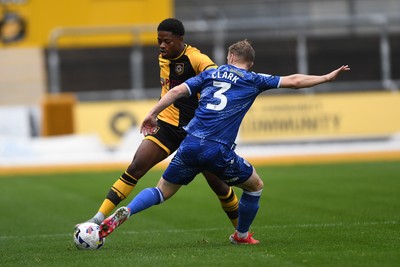 200925 - Newport County v Gillingham - Sky Bet League 2 - Bobby Kamwa of Newport County is challenged by Max Clark of Gillingham