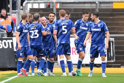 200925 - Newport County v Gillingham - Sky Bet League 2 - Jonny Smith of Gillingham celebrates scoring a goal with team mates