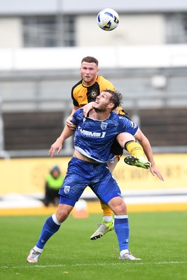200925 - Newport County v Gillingham - Sky Bet League 2 - Lee Jenkins of Newport County is challenged by Josh Andrews of Gillingham