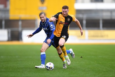 200925 - Newport County v Gillingham - Sky Bet League 2 - Lee Jenkins of Newport County is challenged by Elliott Nevitt of Gillingham