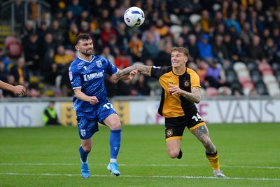 200925 - Newport County v Gillingham - Sky Bet League 2 - Kai Whitmore of Newport County is challenged by Jonny Smith of Gillingham
