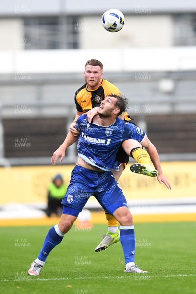 200925 - Newport County v Gillingham - Sky Bet League 2 - Lee Jenkins of Newport County is challenged by Josh Andrews of Gillingham