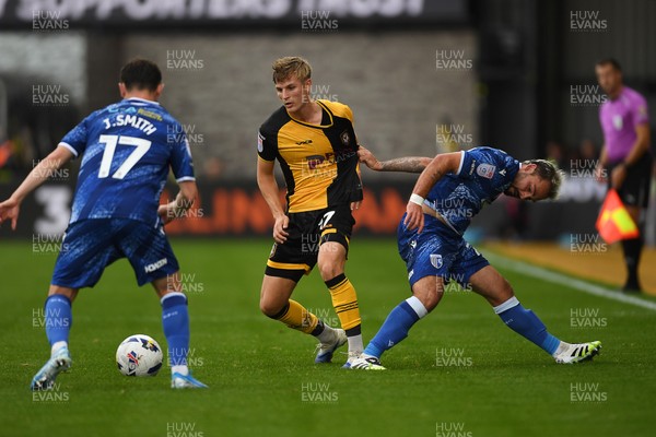 200925 - Newport County v Gillingham - Sky Bet League 2 - Tom Davies of Newport County is challenged by Jonny Smith of Gillingham