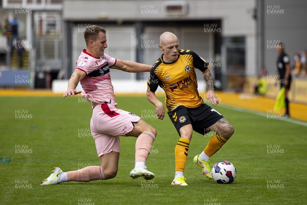 030922 - Newport County v Grimsby Town - Sky Bet League 2 - James Waite of Newport County is tackled by Gavan Holohan of Grimsby Town