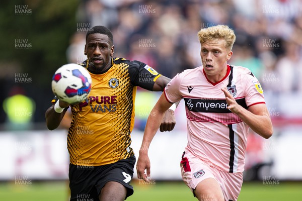 030922 - Newport County v Grimsby Town - Sky Bet League 2 - Omar Bogle of Newport County in action with Andy Smith of Grimsby Town