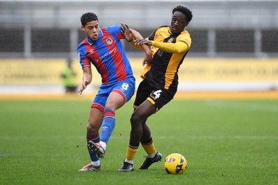 070226 - Newport County v Grimsby Town - Sky Bet League 2 - Nathan Opoku of Newport County is challenged by Evan Khouri of Grimsby