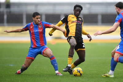 070226 - Newport County v Grimsby Town - Sky Bet League 2 - Nathan Opoku of Newport County is challenged by Evan Khouri of Grimsby