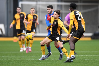 070226 - Newport County v Grimsby Town - Sky Bet League 2 - Harrison Biggins of Newport County is challenged by Geza David Turi of Grimsby